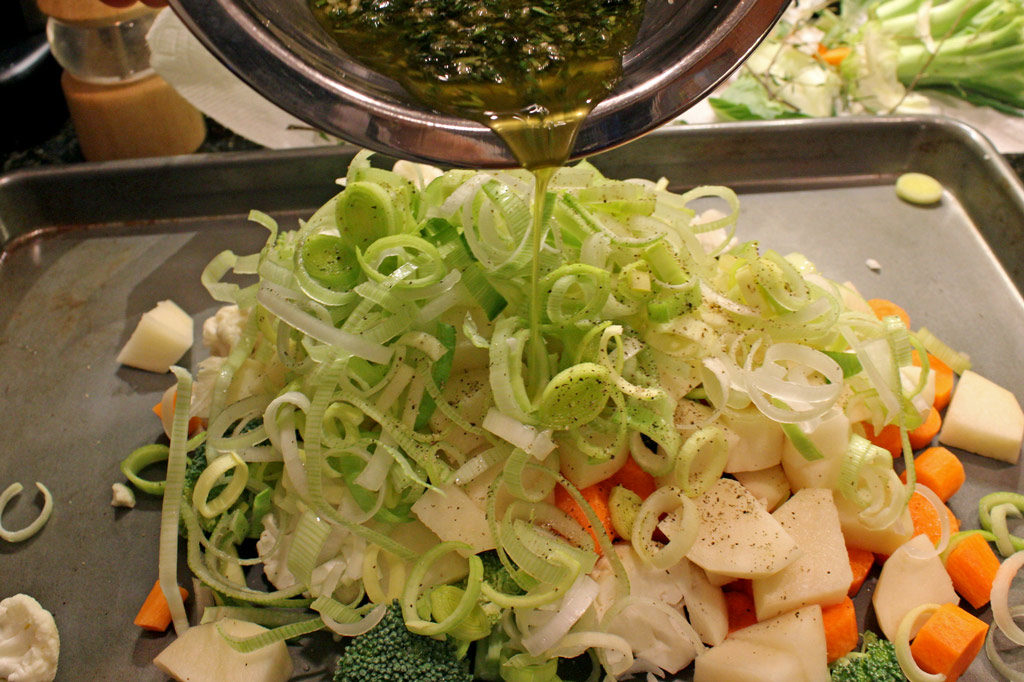 pouring the oil on vegetables