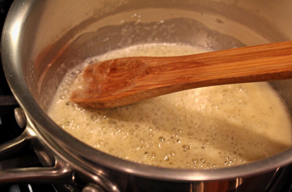 stirring the cream sauce