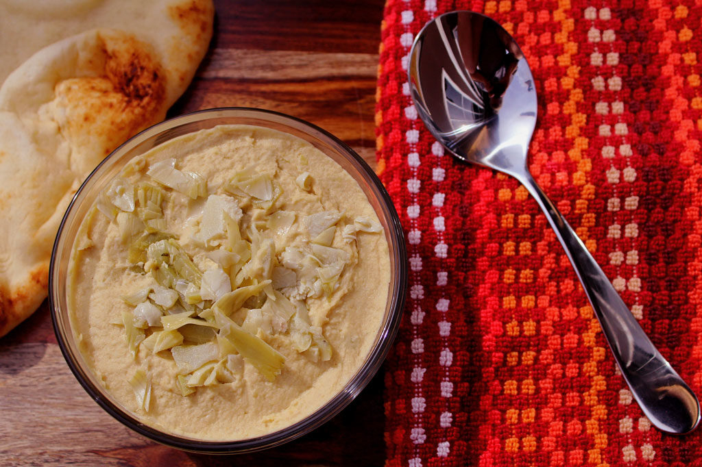 Marinated Artichoke Hummus: The artichokes seem to lighten up the denseness that hummus can have and offers a tanginess that makes it seem lighter. So good! | TheMountainKitchen.com