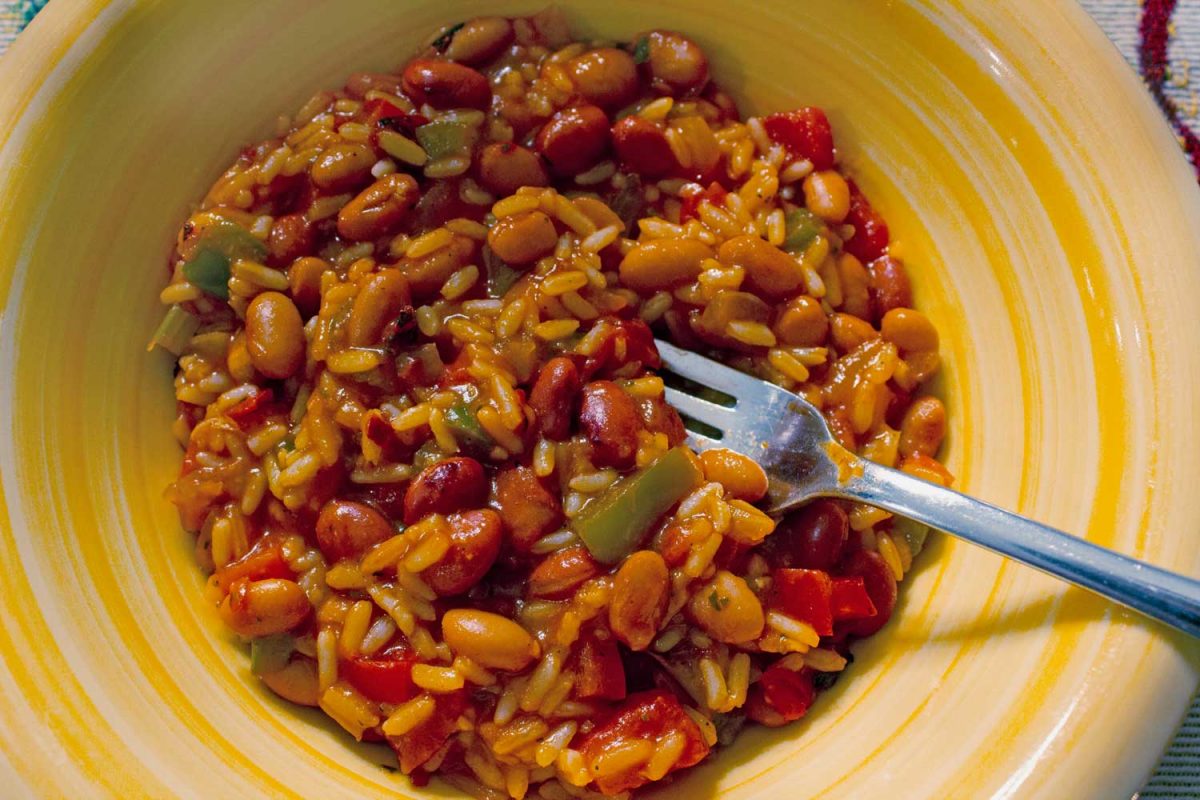 vegetarian jambalaya in bowl with fork