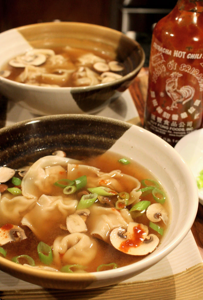 wonton soup in bowls with sriracha