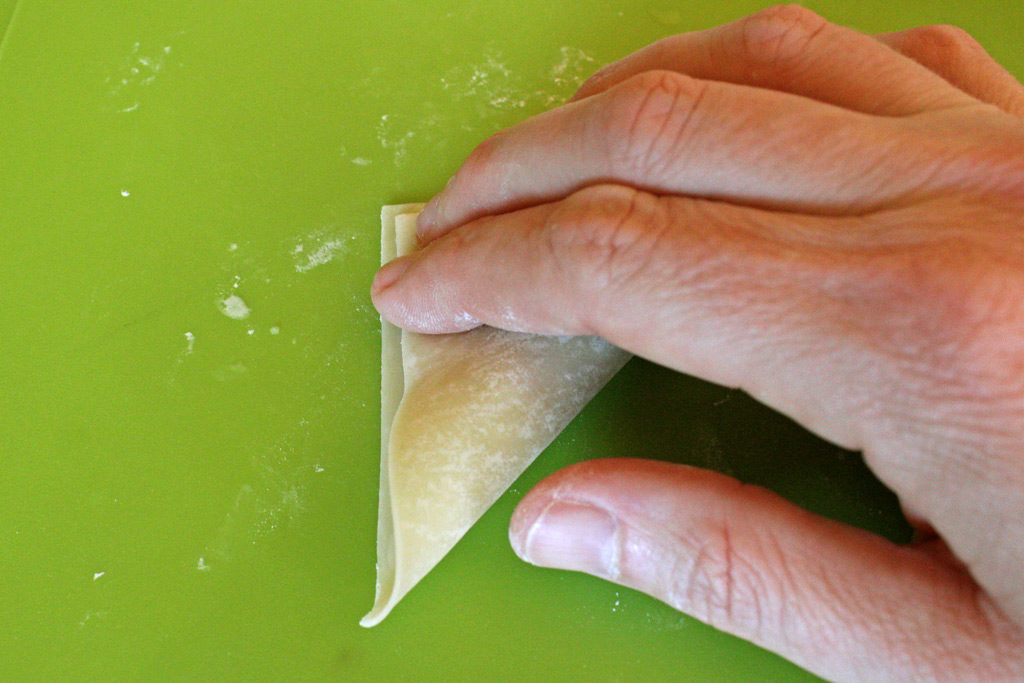 sealing wonton into triangle shape