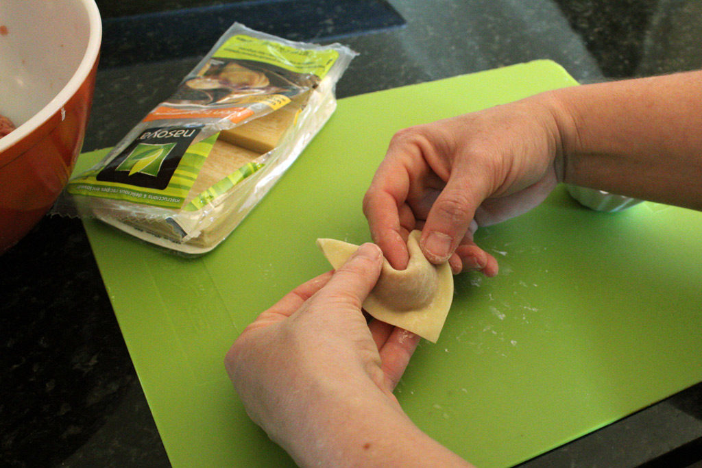 forming wonton with fingers
