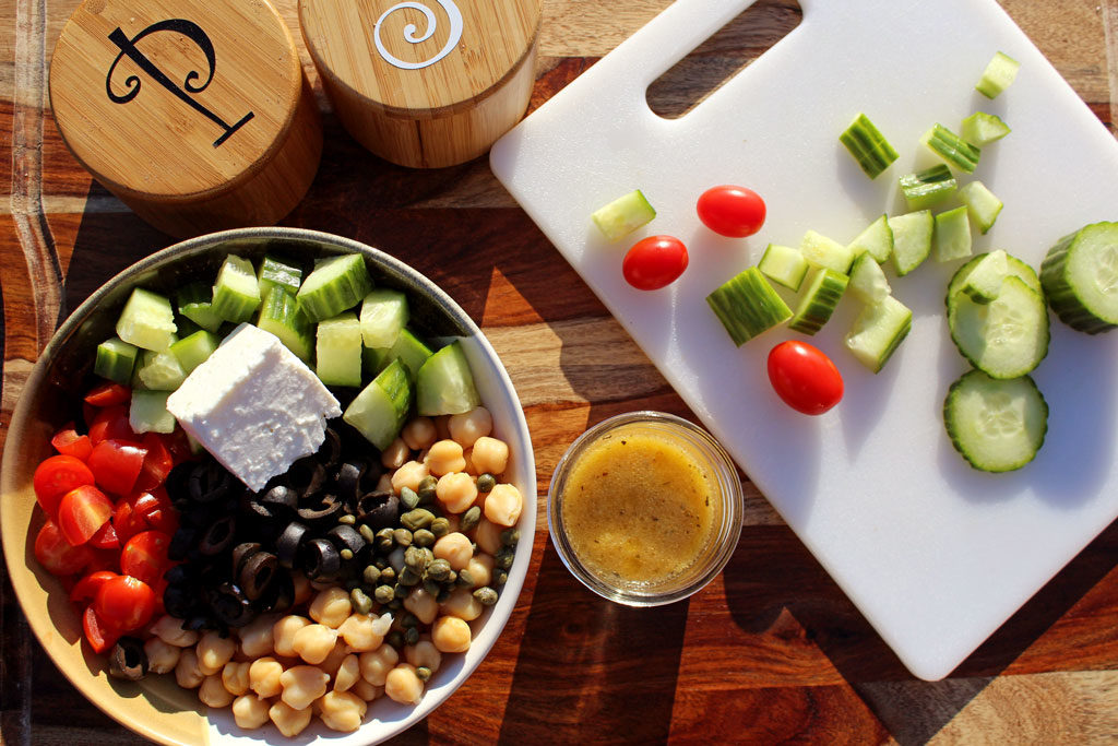 This amazing Greek Chickpea Salad is healthy light and fresh and is loaded with protein packing chickpeas, that will leave you feeling fuller longer. Tasty! | TheMountainKitchen.com
