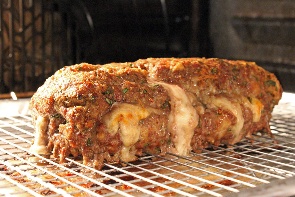 cheese oozing out of the Italian meatloaf