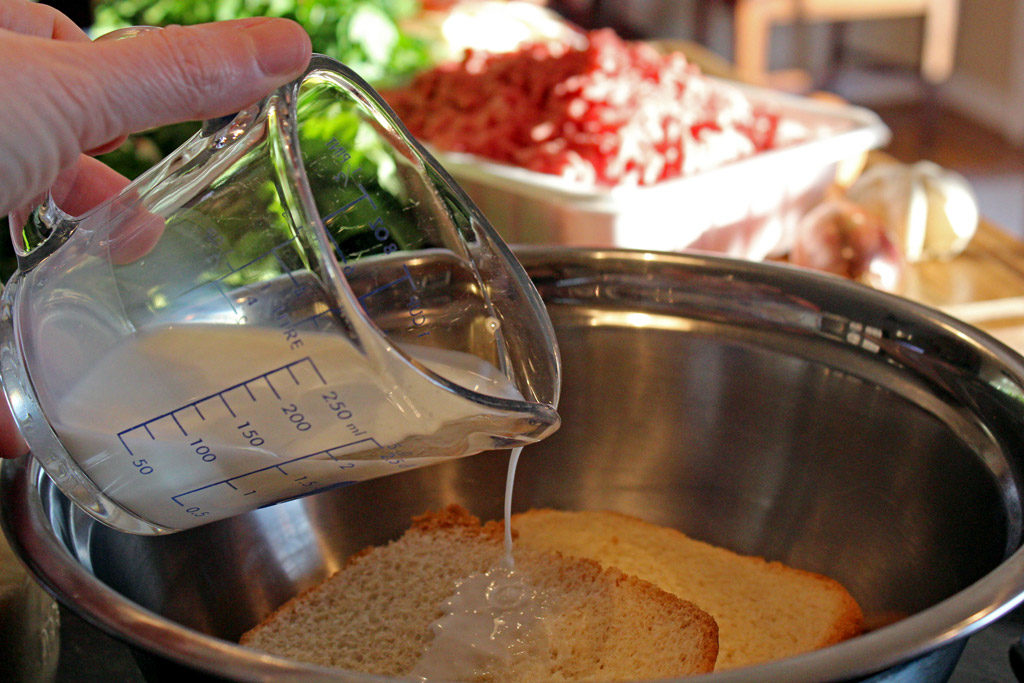 pouring milk onto bread