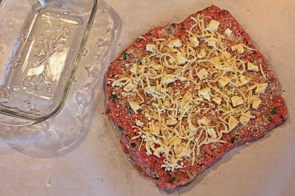 cheese on top of the flattened meat mixture