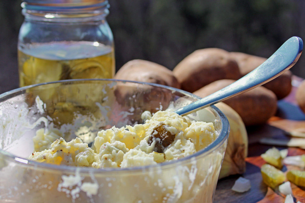 This crowd pleasing potato salad features bite-sized potatoes and chopped sweet pickles and onion mixed with a creamy, tangy dressing, with a zippy finish. | TheMountainKitchen.com