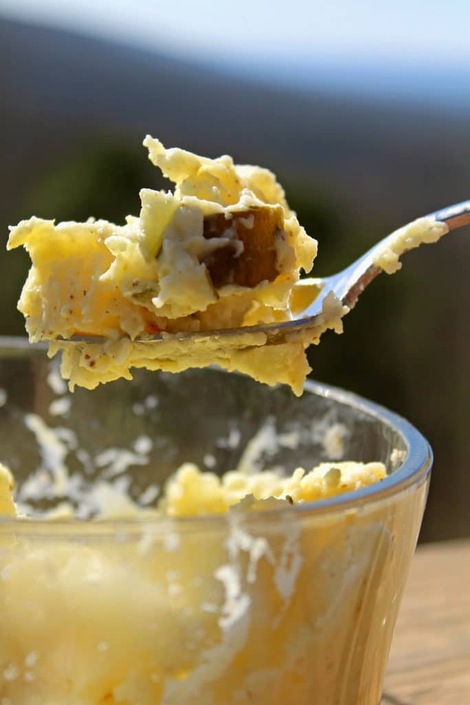 Mama Rosa's Potato salad recipe made in a bowl with a bite in a spoon