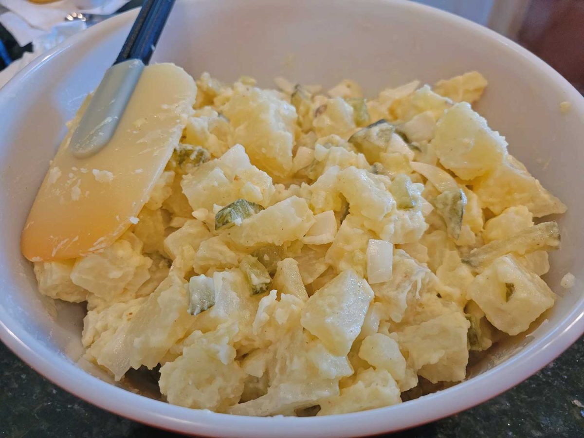 potato salad in bowl with spatula