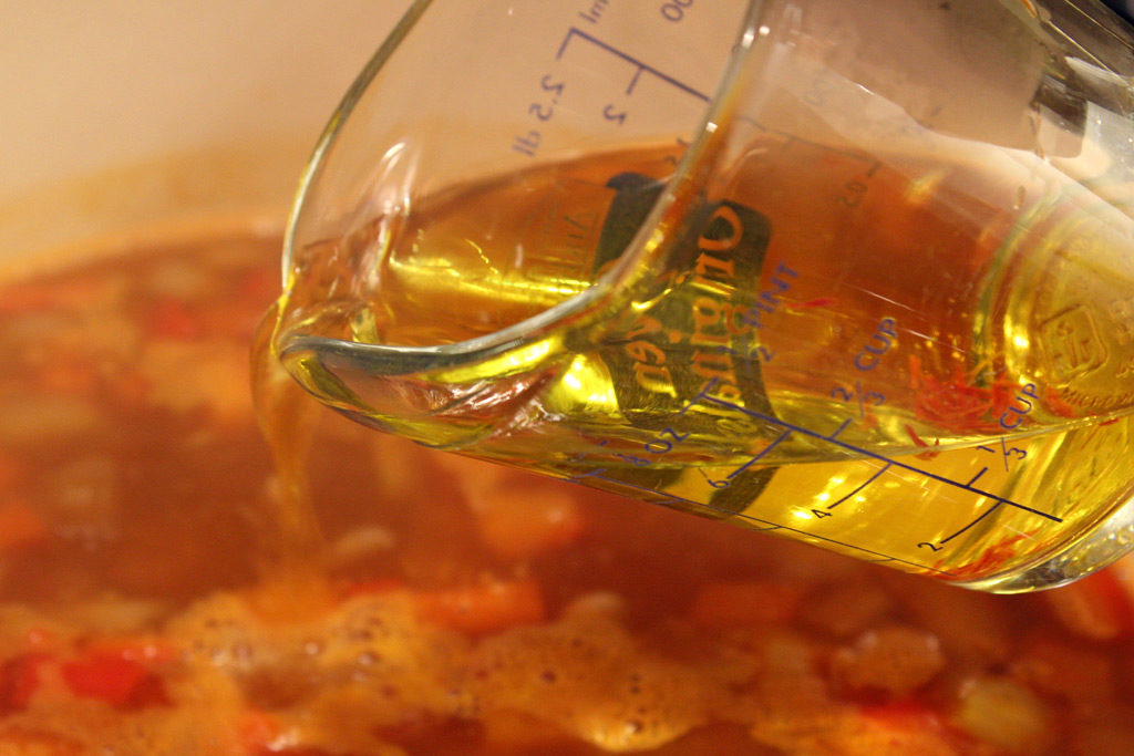pouring saffron liquid into soup