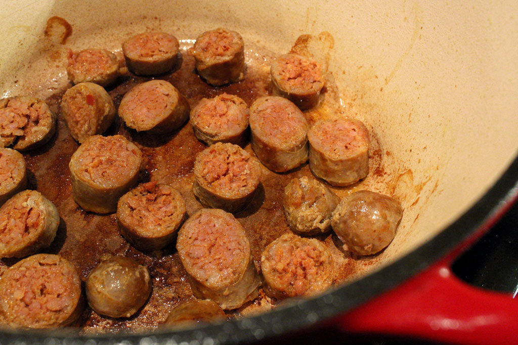 chorizo sausage cooking in pot