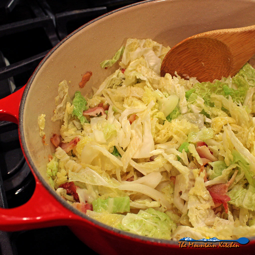 fried cabbage with bacon in Dutch oven