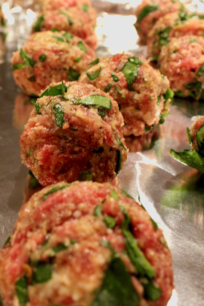 raw meatball on sheet pan