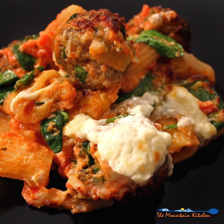 Baked pasta with meatballs and spinach
