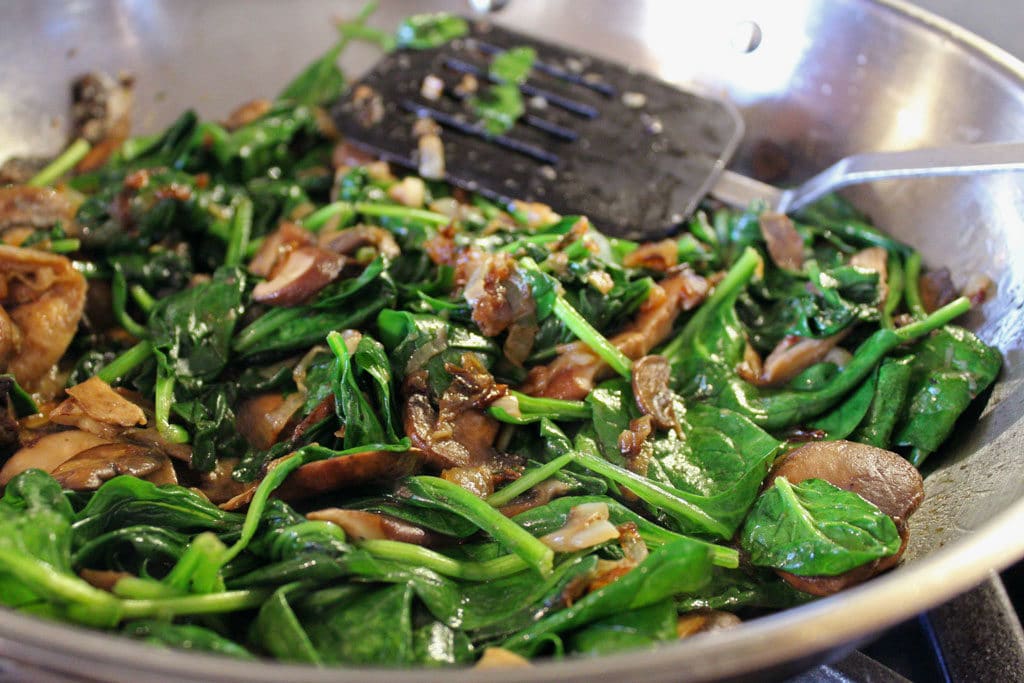 sauted spinach and mushrooms in skillet
