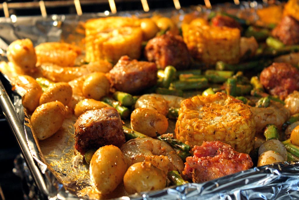 sheet pan dinner cooking in oven