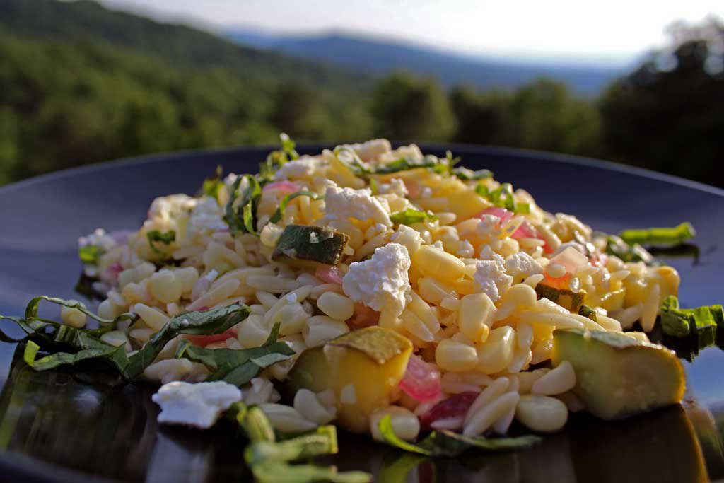 corn zucchini orzo salad with mountain view