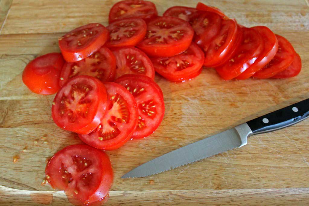 Roasted tomato cheese tart: puff pastry, ripe tomatoes Dijon mustard, smoked Gruyere cheese, simply seasoned with fresh thyme, fresh basil, salt and pepper. | TheMountainKitchen.com