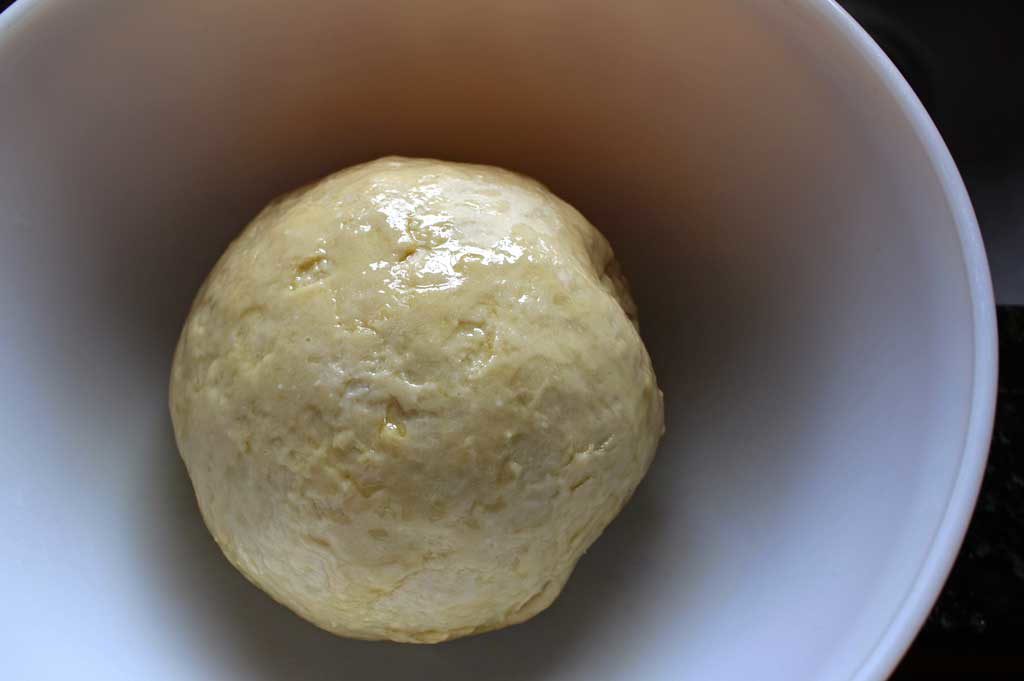 bowl with a ball of focaccia dough inside