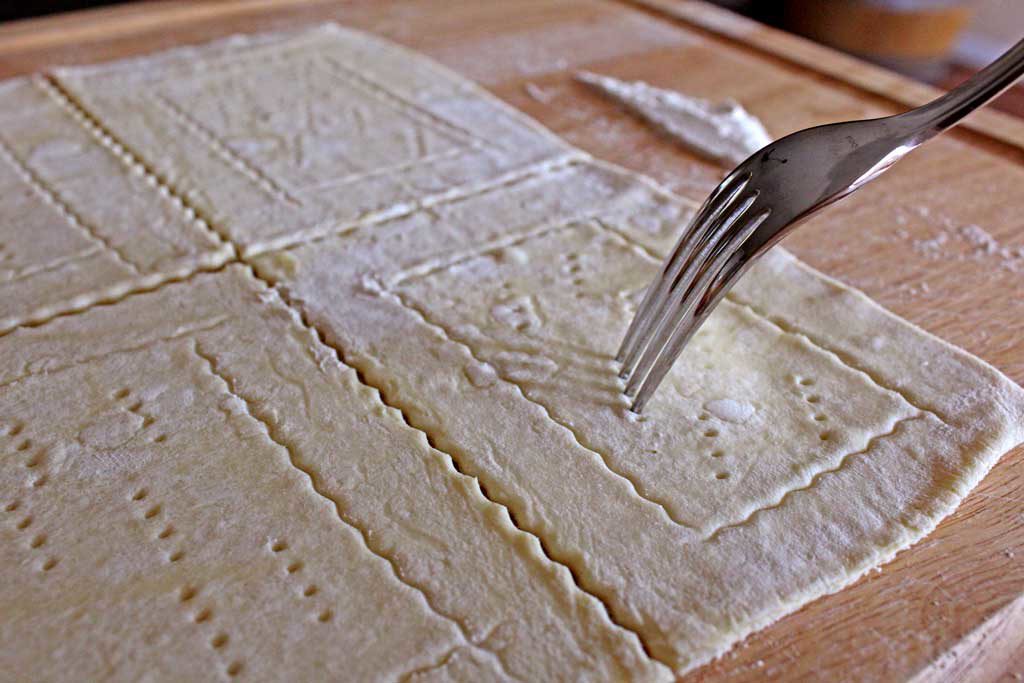 pricking dough with fork