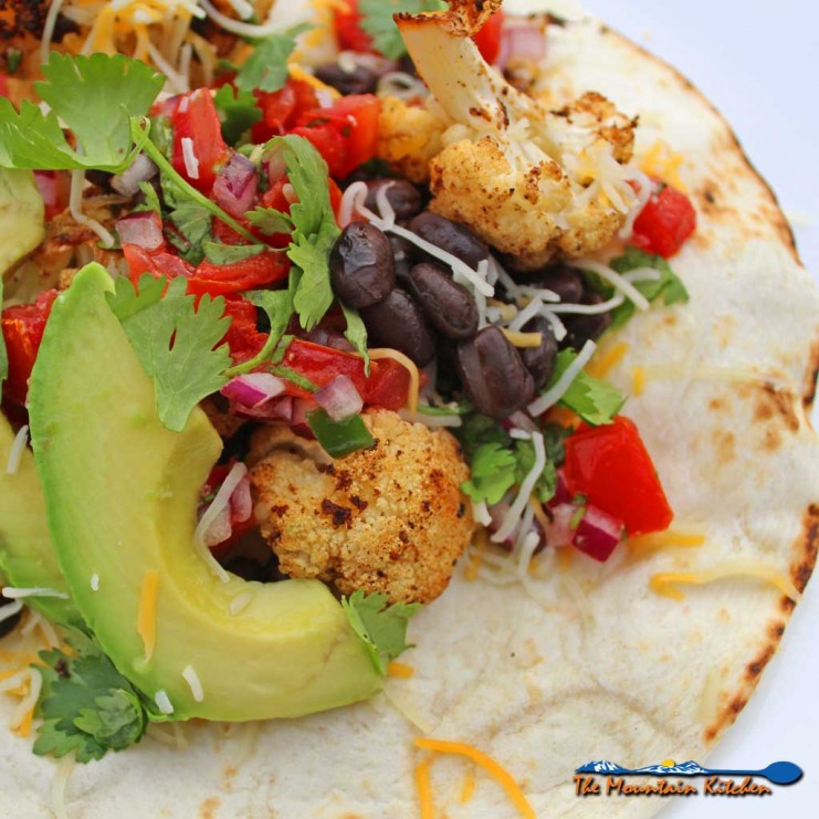 cauliflower black bean tostadas served on plate