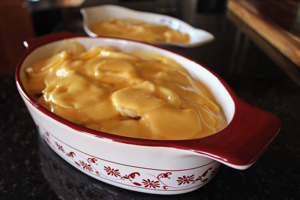 two batches of this potatoes au gratin recipe ready to go in oven