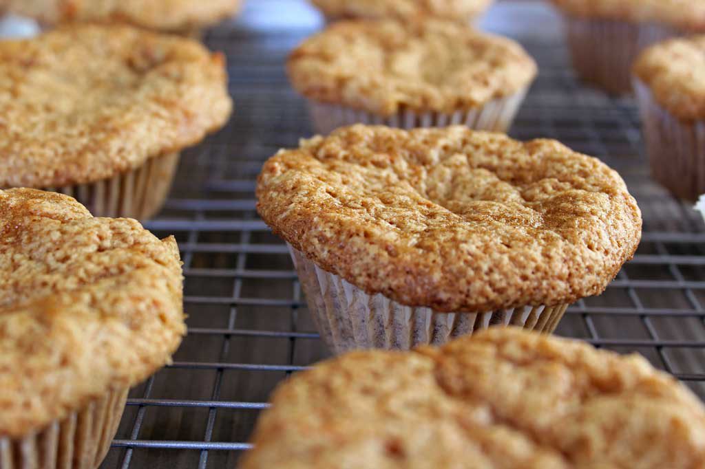carrot cake muffins cooking on wire rack