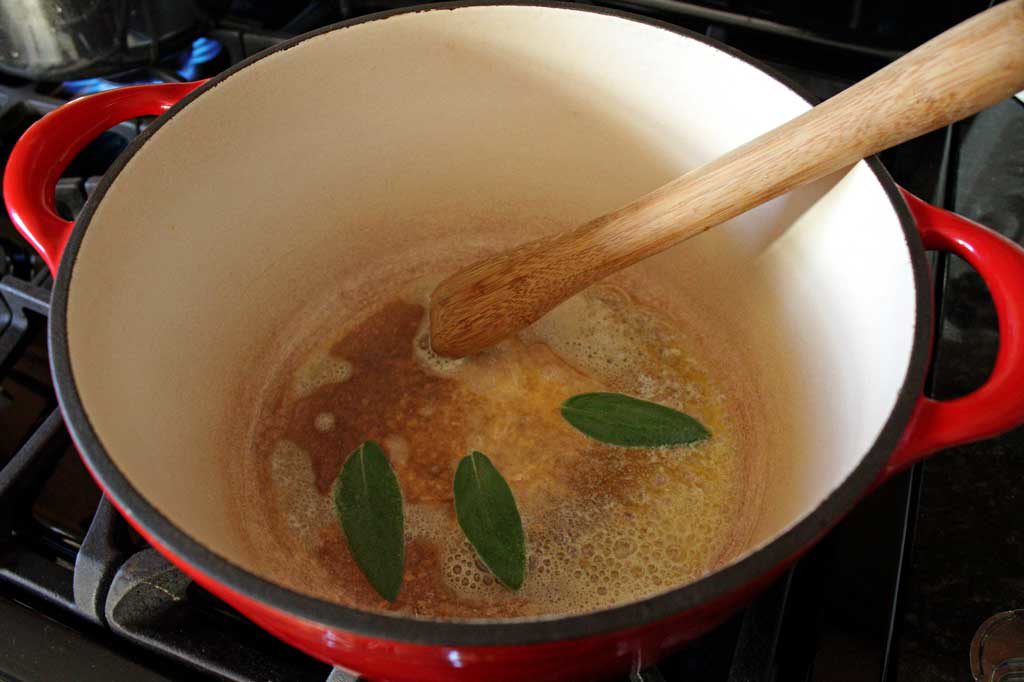sage leaves in pot cooking in butter