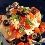 Quick and easy, the chicken breasts in this Mediterranean Chicken dish are basted in lemony broth with red bell peppers, black olives and tangy feta cheese. | TheMountainKitchen.com
