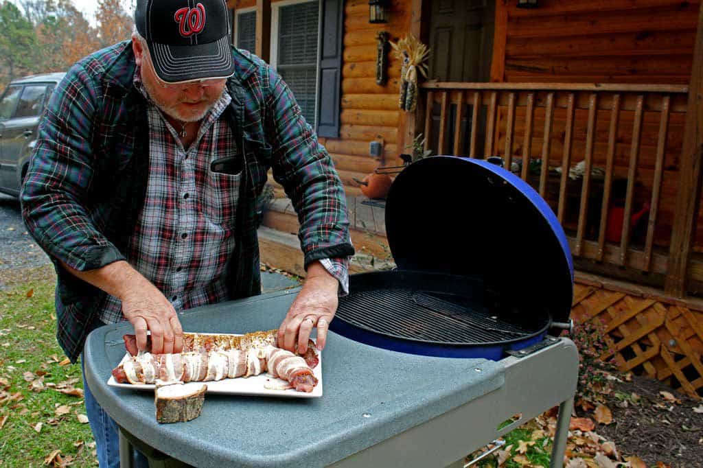 David placing backstraps on grill