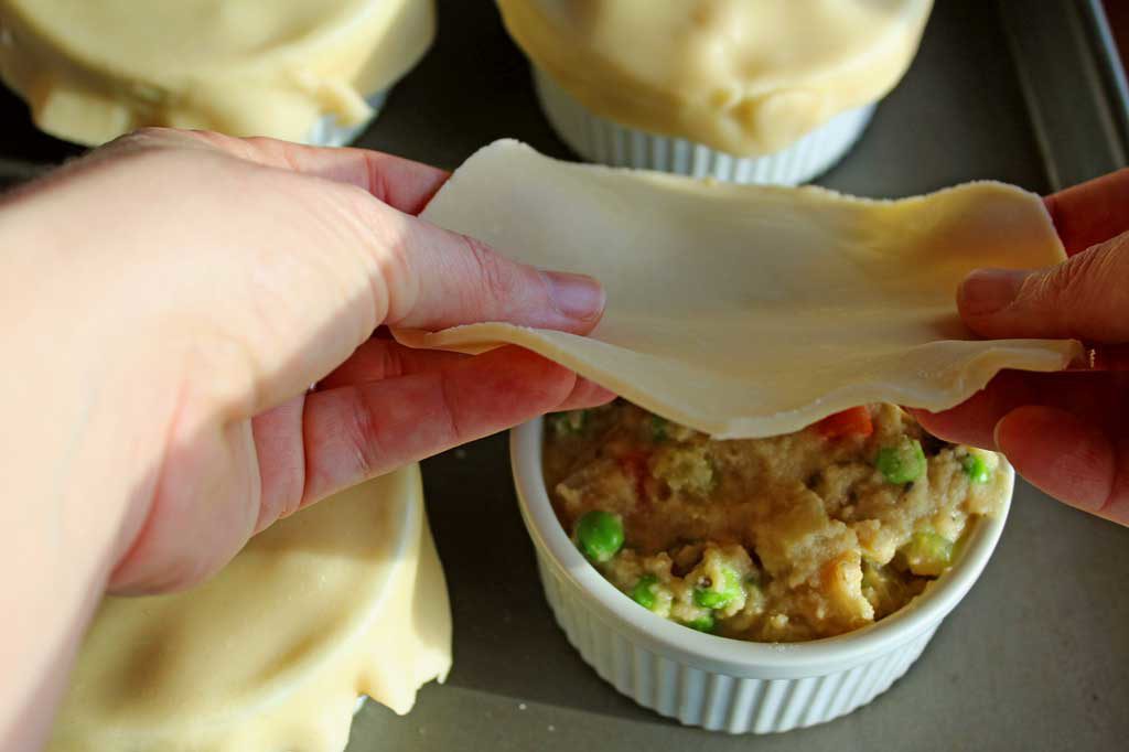 covering the filling with pie dough