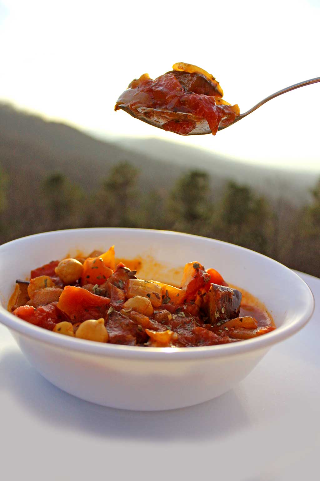 spoonful of Maghmour with mountain view