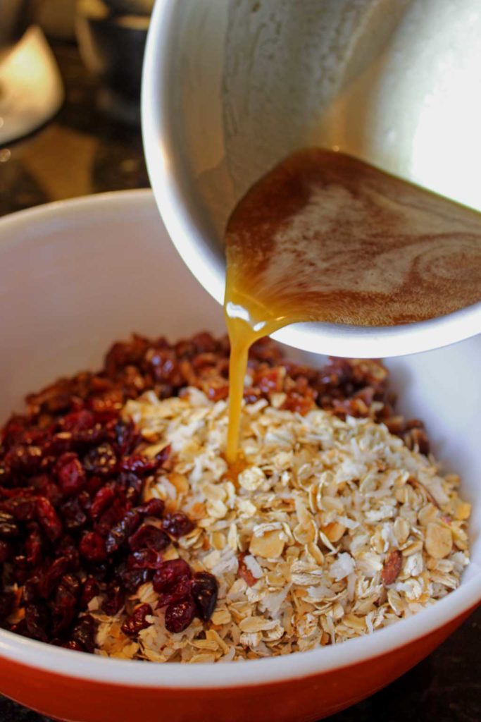 A yummy grab and go breakfast or snack, these wholesome homemade granola bars are easy to make, packed with rolled oats, and toasted coconut mixed combined with a sticky honey brown sugar sauce, with chopped fruit and nuts. Perfect for when there isn’t time to cook, you can simply grab and go! | TheMountainKitchen.com