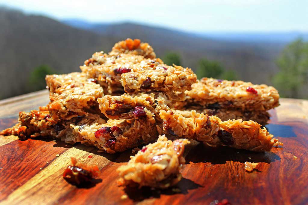 A yummy grab and go breakfast or snack, these wholesome homemade granola bars are easy to make, packed with rolled oats, and toasted coconut mixed combined with a sticky honey brown sugar sauce, with chopped fruit and nuts. Perfect for when there isn’t time to cook, you can simply grab and go! | TheMountainKitchen.com