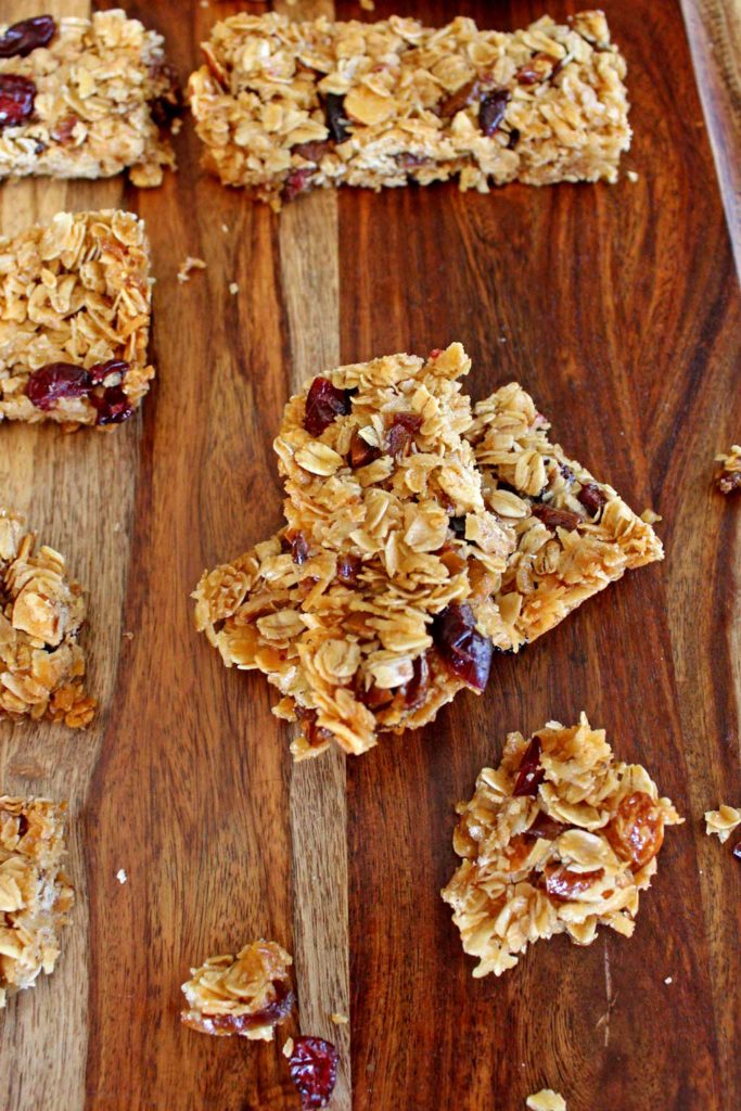 A yummy grab and go breakfast or snack, these wholesome homemade granola bars are easy to make, packed with rolled oats, and toasted coconut mixed combined with a sticky honey brown sugar sauce, with chopped fruit and nuts. Perfect for when there isn’t time to cook, you can simply grab and go! | TheMountainKitchen.com