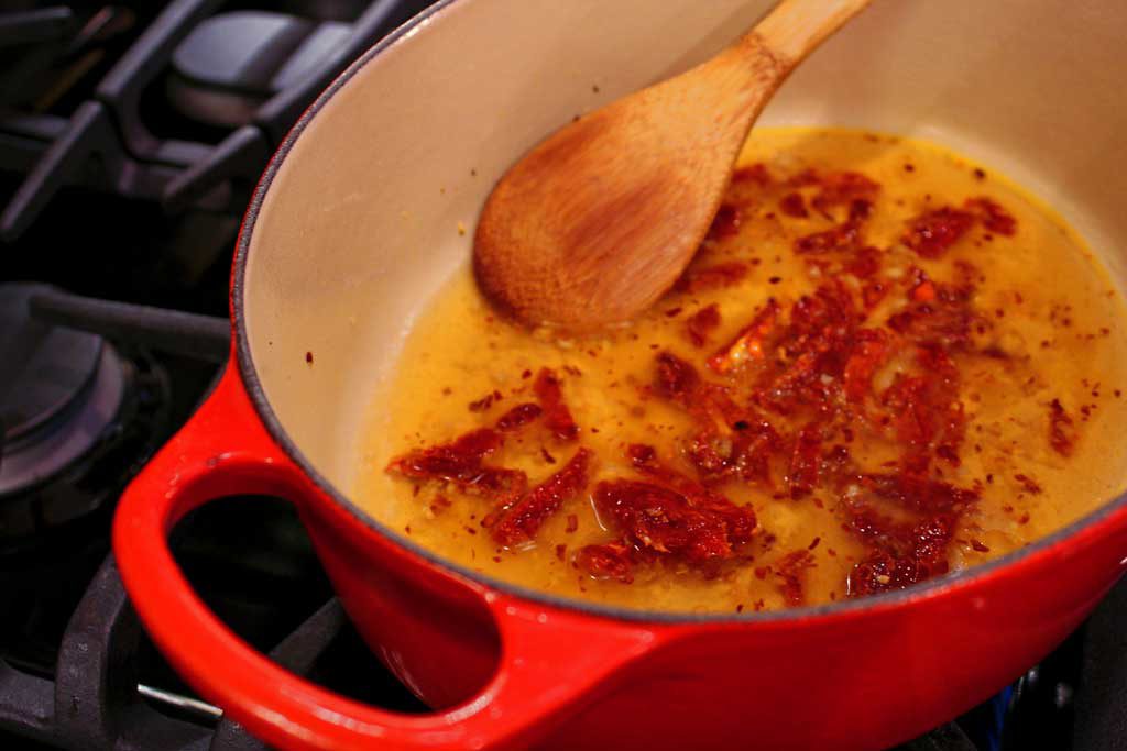 cooking sun-dried tomatoes in skillet