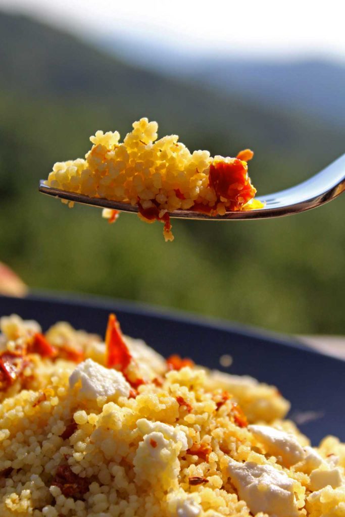 This Mediterranean Couscous gets wonderful flavor from chicken broth, sweet and tangy sun-dried tomatoes, feta cheese and a touch of heat red pepper flakes. | TheMountainKitchen.com
