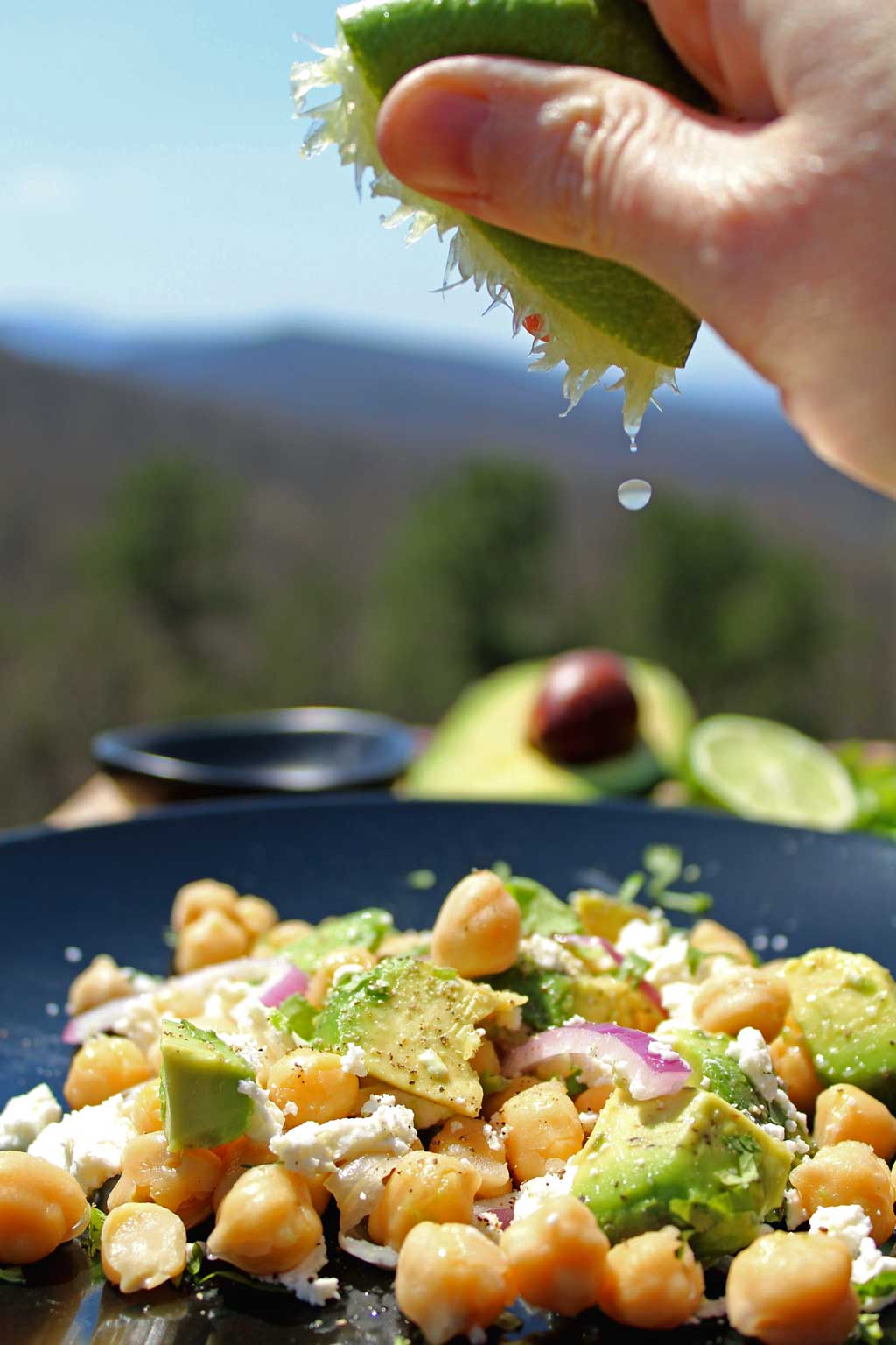 squeezing lime onto salad