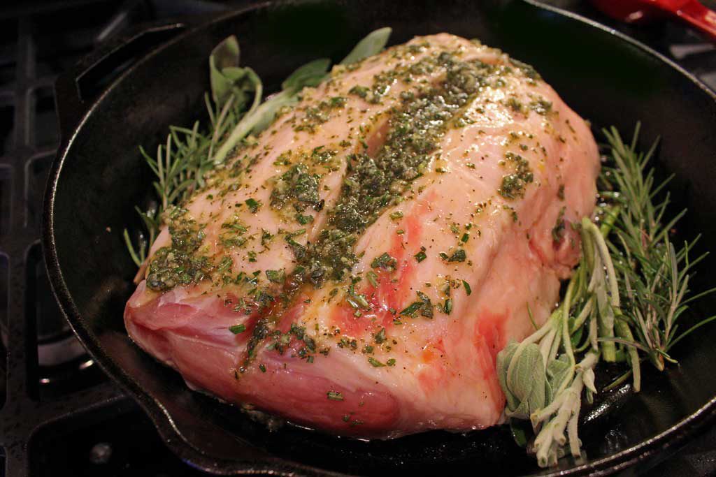 There is nothing like a well-seasoned incredibly tender pork roast, pan-seared with herbs and garlic oven-roasted to perfection. Roasted pork is amazing! | TheMountainKitchen.com