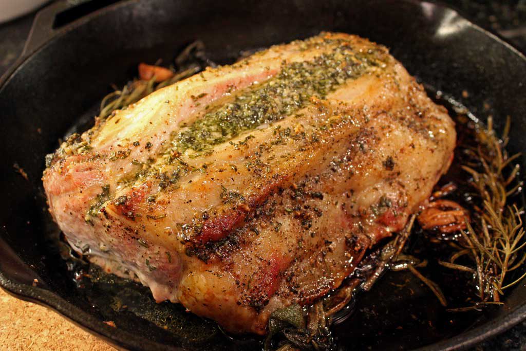There is nothing like a well-seasoned incredibly tender pork roast, pan-seared with herbs and garlic oven-roasted to perfection. Roasted pork is amazing! | TheMountainKitchen.com