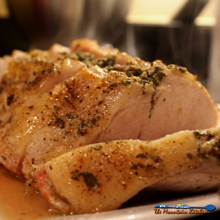 There is nothing like a well-seasoned incredibly tender pork roast, pan-seared with herbs and garlic oven-roasted to perfection. Roasted pork is amazing! | TheMountainKitchen.com