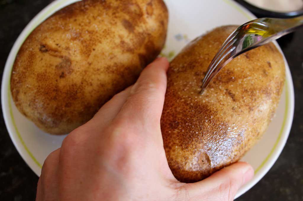 piercing potato with fork