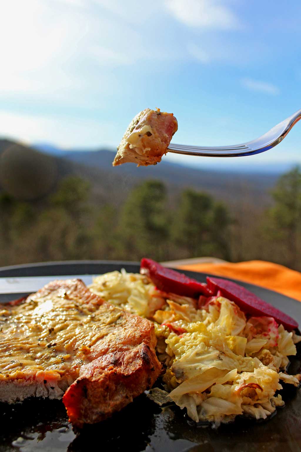 Dijon pork chops dredged in lemony Dijon mustard with herbs, roasted on a bed of cabbage in a rich broth. Try with roasted beets with apple cider vinegar! | TheMountainKitchen.com