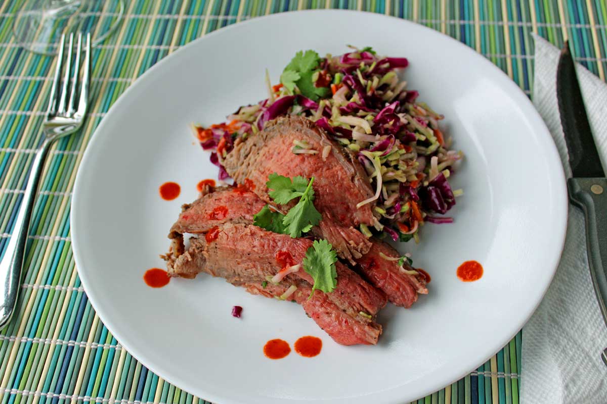 This is a quick and easy Grilled Thai Steak Salad is infused with such amazing Asian flavor. Crisp salad paired with grilled flank steak. Try it tonight! | TheMountainKitchen.com