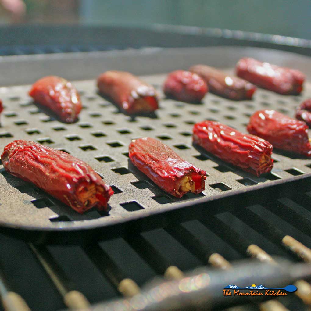 jalapenos on tray on smoker
