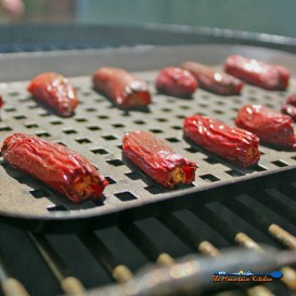 jalapenos on tray on smoker