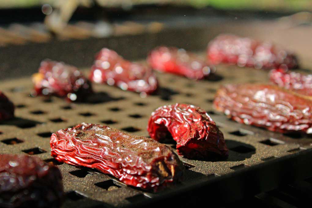 smoked chipotle peppers on smoker