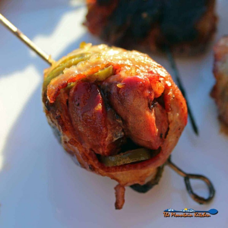 Bacon wrapped dove poppers a great way to celebrate the hunt! A great balance of grilled fatty bacon, tangy chilies, savory-sweet garlic, and smoky meat.