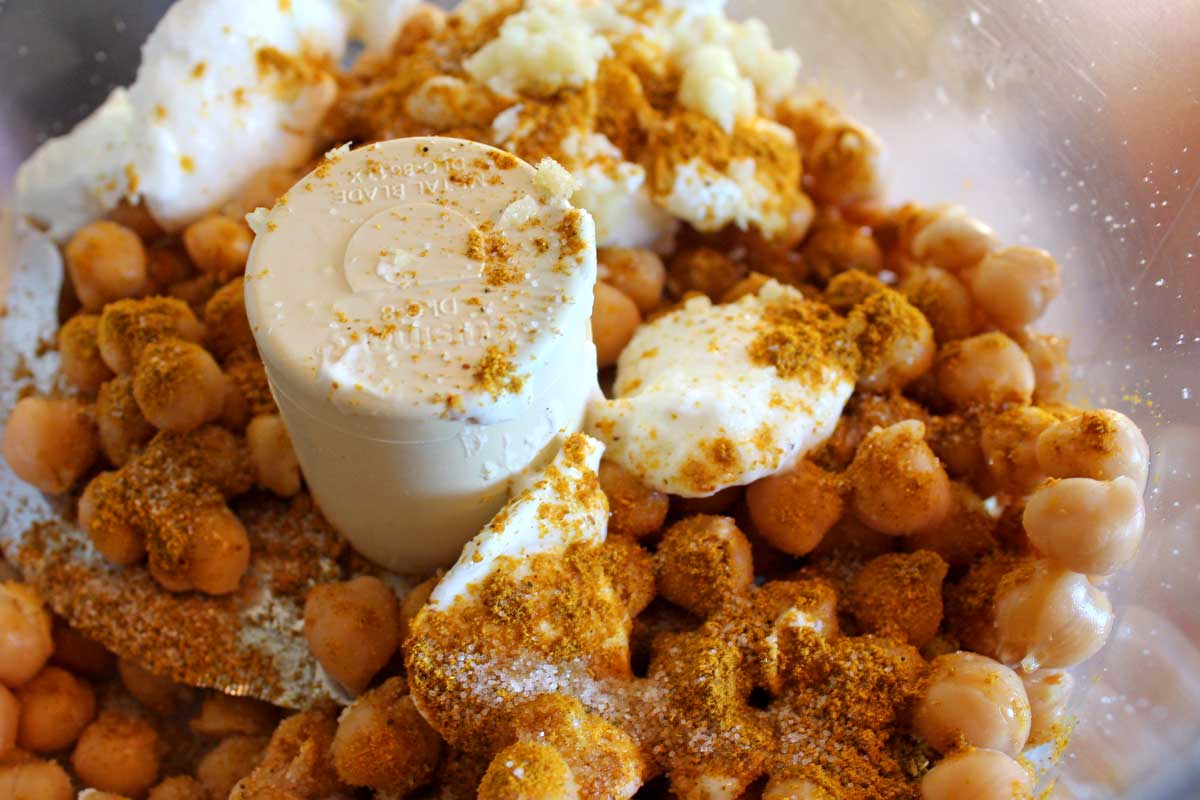 chickpeas and ingredients inside a food processor